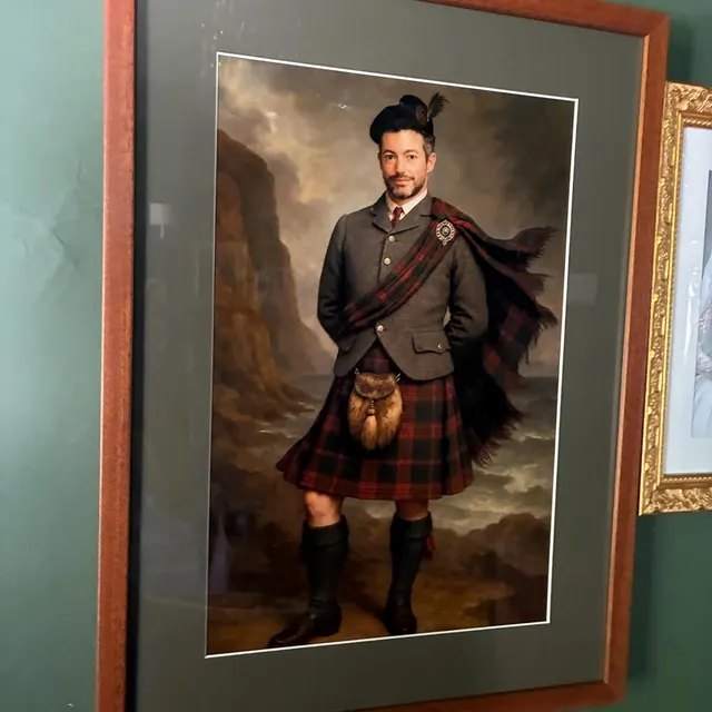 Highland gentleman portrait framed on a green wall