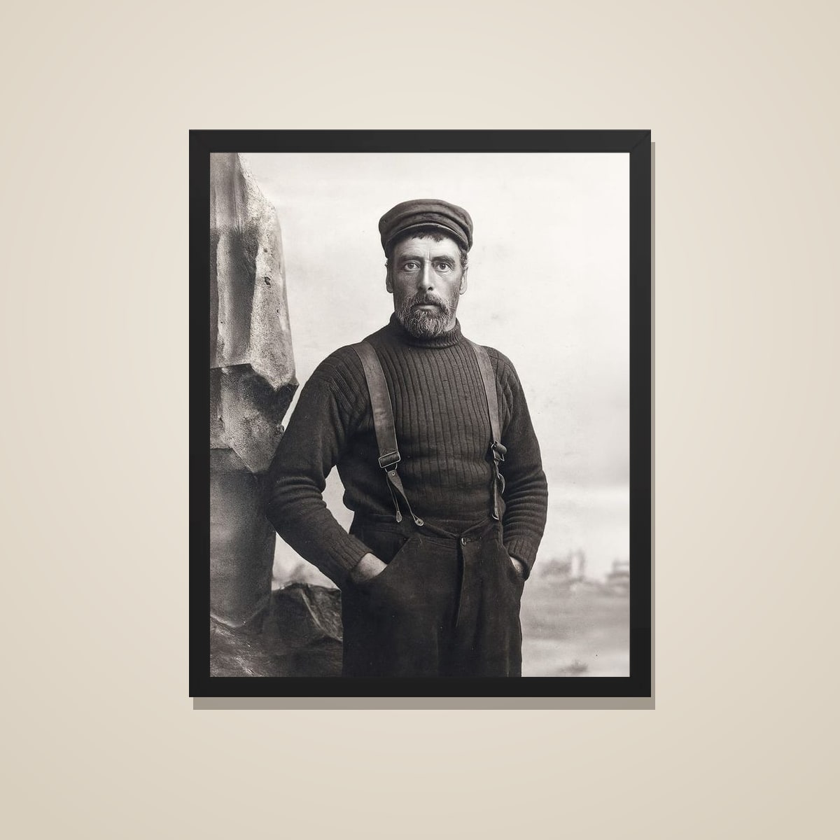 Old sailor portrait printed and framed in black, on a warm wall