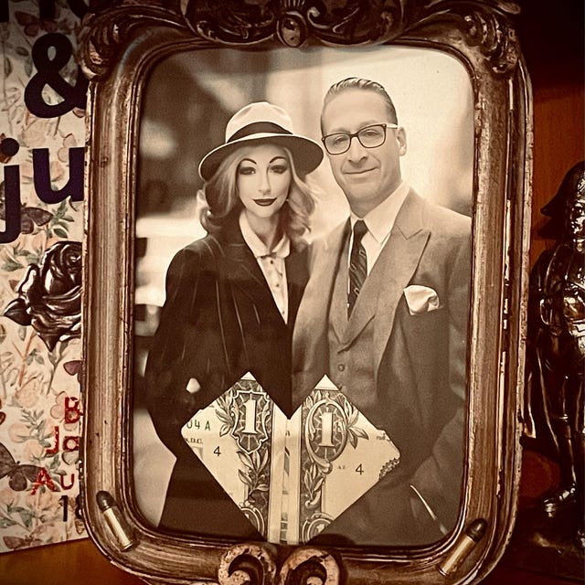1930s couple portrait in an ornate silver frame
