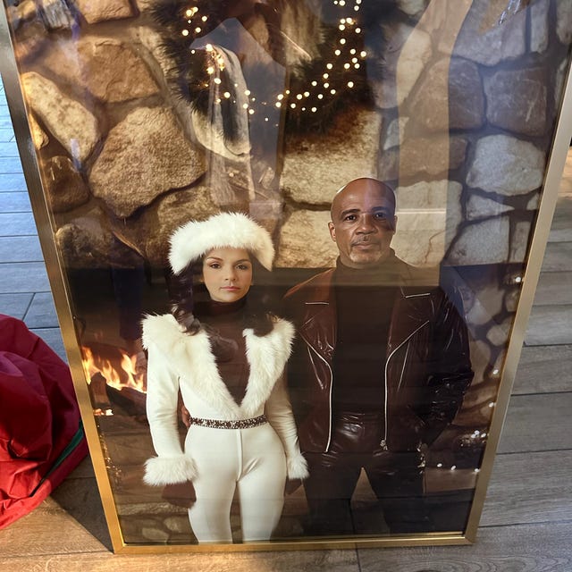 A 1970s ski couple portrait propped by a fireplace